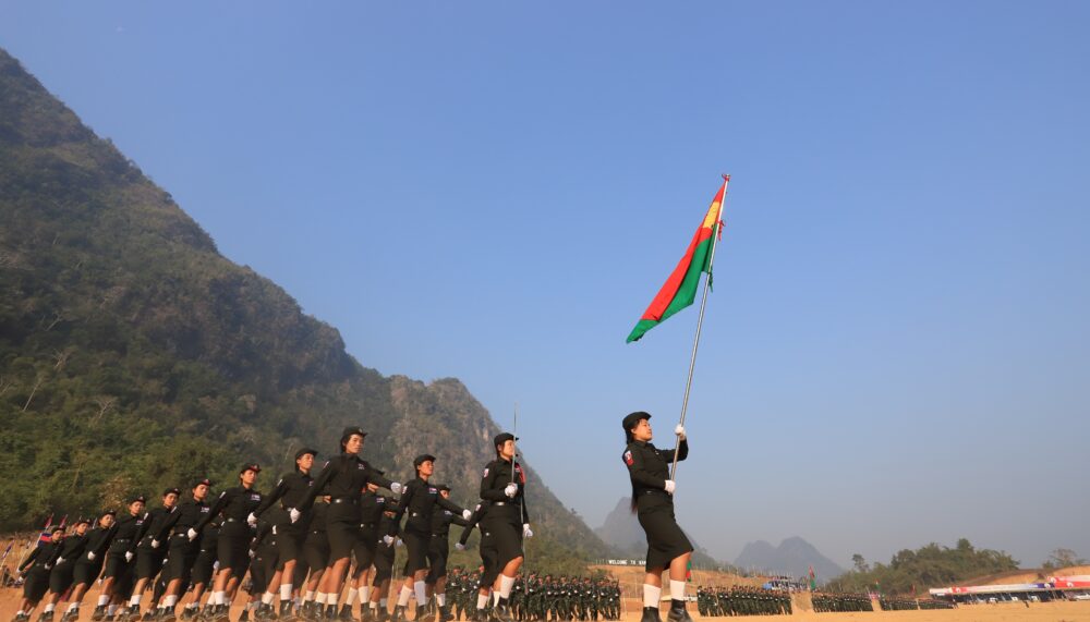 The Karen National Liberation Army (KNLA) holding their flag.